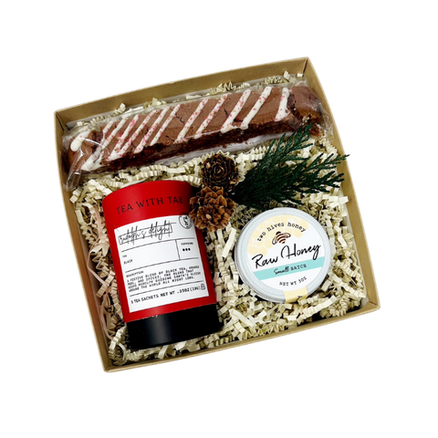 holiday gift box with holiday tea, honey and a chocolate mint biscotti