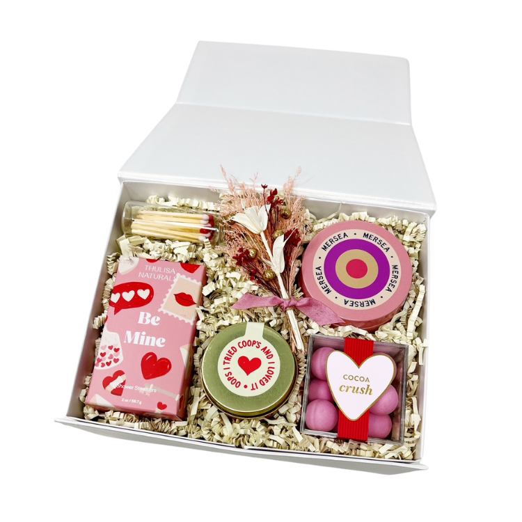 valentines day gift box with candle, matches, candy, peppermint chocolate and shower steamers