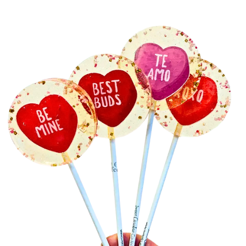 Individually wrapped conversational heart lollipops, in variations of purple, red, pinks and in the flavor 'pear'. 
All lollipops are vegan, gluten free, dairy free, and nut free. 
Made in the United States.
Dimensions: 2 1/4” in diameter
Flavor: Pear
Size: 1.3 oz (36g).
Branded Stick: 6" long, 5 /32" thick