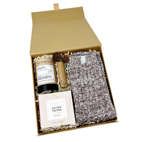 cozy up gift box with pair of softies marshmallow crew socks, chai tea, lavender lip balm and butter toffee pretzels