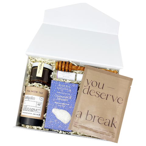 send a get well soon gift box that is full of soothing products like chamomile lavender bath salts, a soothing face mask, chai tea, raw honey and an essential oil that eases tension and headaches.