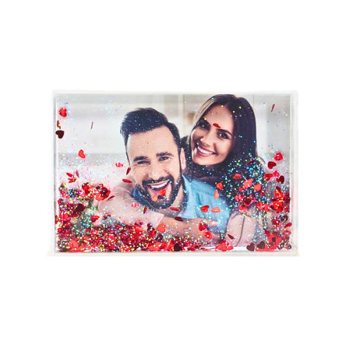 A 4x6 size photo frame that contains glitter and red hearts that move around. 
Can be used to hold a horizontal or vertical photo. 
Please email steely@bonvivantdelivered.com the image you would like us to print out and place inside picture frame. 