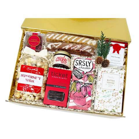 a shareable holiday gift with chocolate and peppermint flavored popcorn, chocolate bars, butter toffee, fudge, biscotti and cranberry candies and a mini holiday scented candles