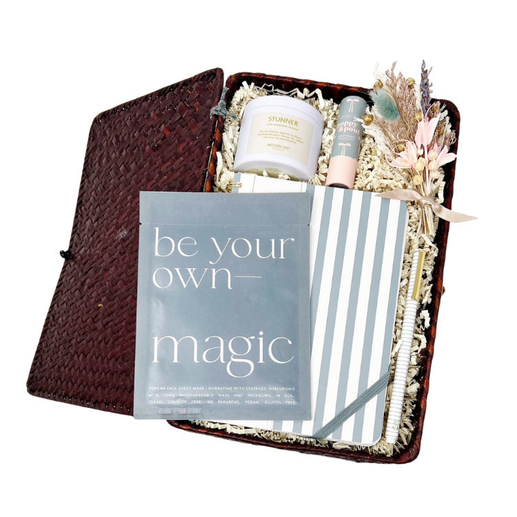 gift basket with 'be your own magic' facial sheet mask, striped notebook, pen, 'Stunner' travel candle, lip balm and handmade dried floral bundle. Perfect for gifts for her, birthday gifts, new job gift, new beginnings, new year's goals.