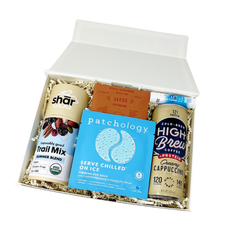 Garden & Glow gift box with summer trail mix, cold brew coffee, planting seed mix, cooling eye gels and a SPF 15 lip balm.