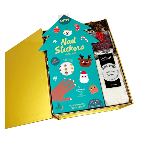 Kid's christmas gift box with Box of nail holiday nail stickers with a festive design, vanilla bean marshmallows and sugared cranberry candies