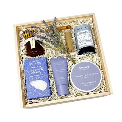 lavender chamomile themed gift box with bath salts, hand cream, body scrub, calming tea, honey, honey drizzle stick, lip balm and dried lavender bundle
