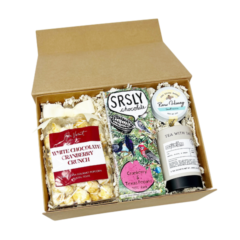 gift box with popcorn, dark chocolate bar, winter tea and raw honey