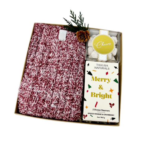 holiday gift box with women's cozy crew socks, holiday shower steamers and champagne-flavored gummy candy