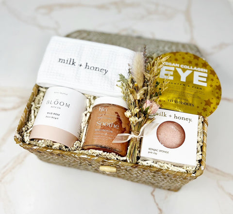 spa day gift box with headband, collagen eye gels, rose bath bomb. coconut body scrub and pink clay konjac sponge