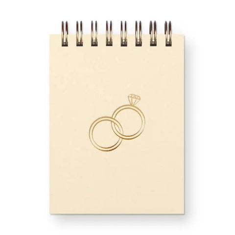 A 3x4 mini gold-foil pressed ring notebook with 65 unlined pages. Perfect for notes, lists, or sweet doodles.
Made in the United States.