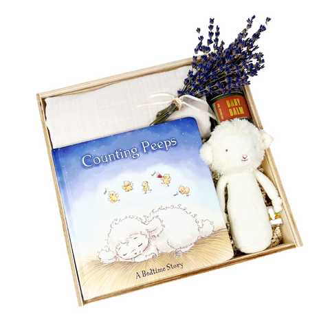 new baby newborn gift box with lamb rattle, swaddle blanket, baby balm and counting peeps bedtime book