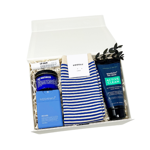 Father's day gift box with striped crew socks, face moisturizer, lip balm, hand sanitizer and activated charcoal face wash.
