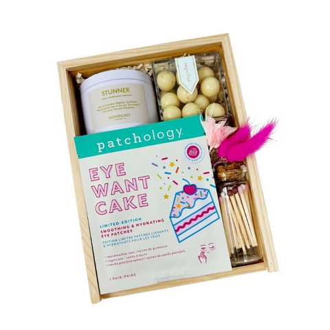 birthday gift box containing birthday eye patches, travel size stunner candle, confetti cake caramels and matches.